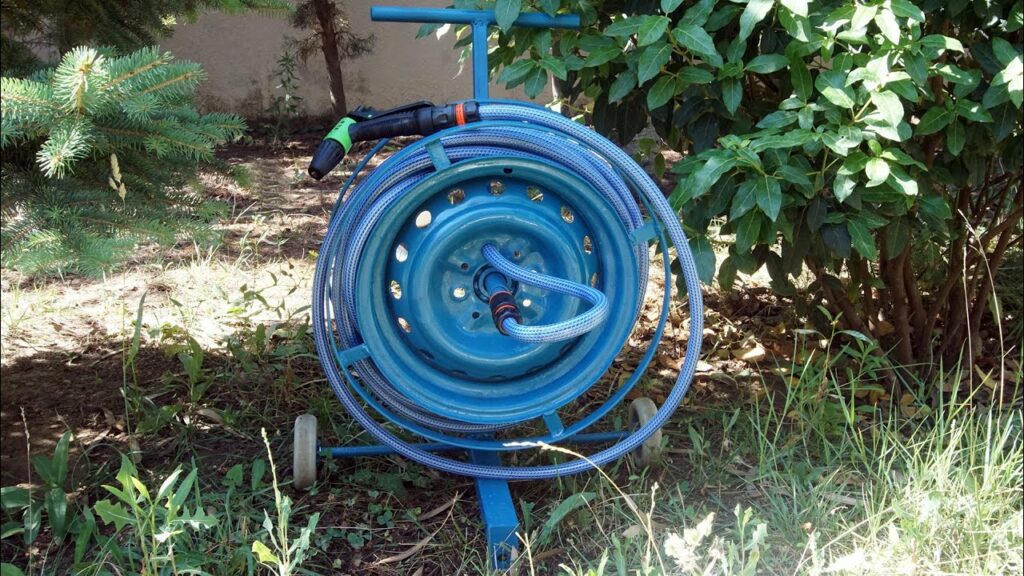 Use a Bucket or Old Wheel To Hang Your Garden Hose